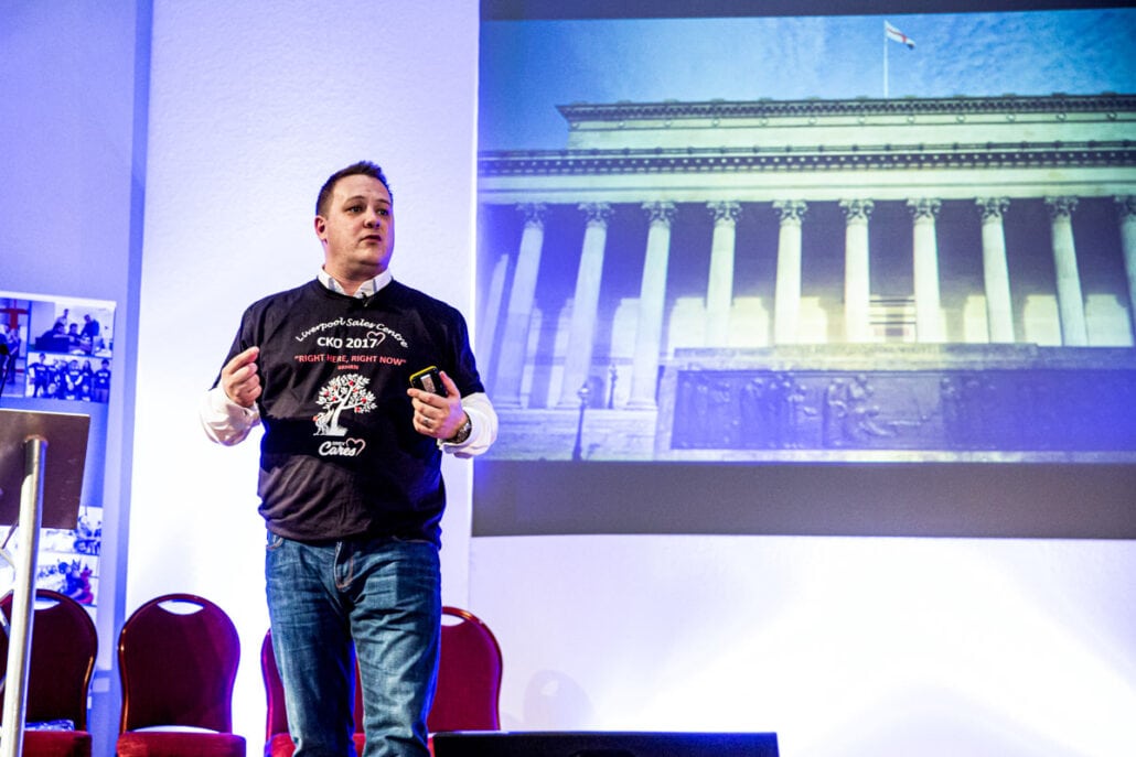 speaker on stage at liverpool conference